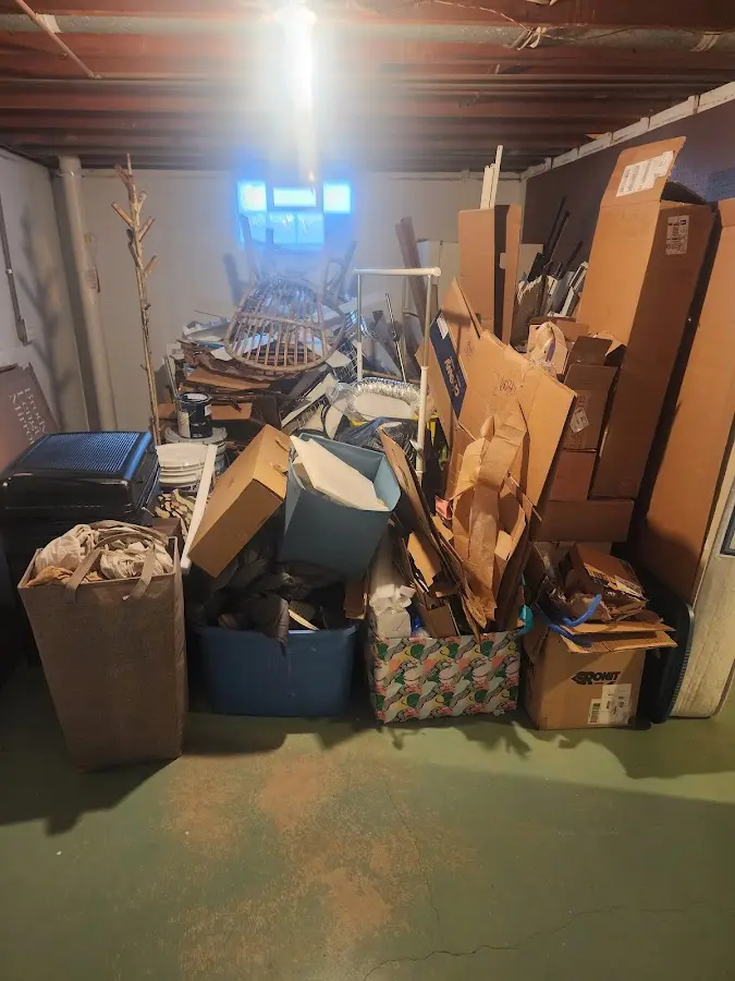 Roll-off dumpster container at job site for Yard Waste Dumpster Rental in Milford